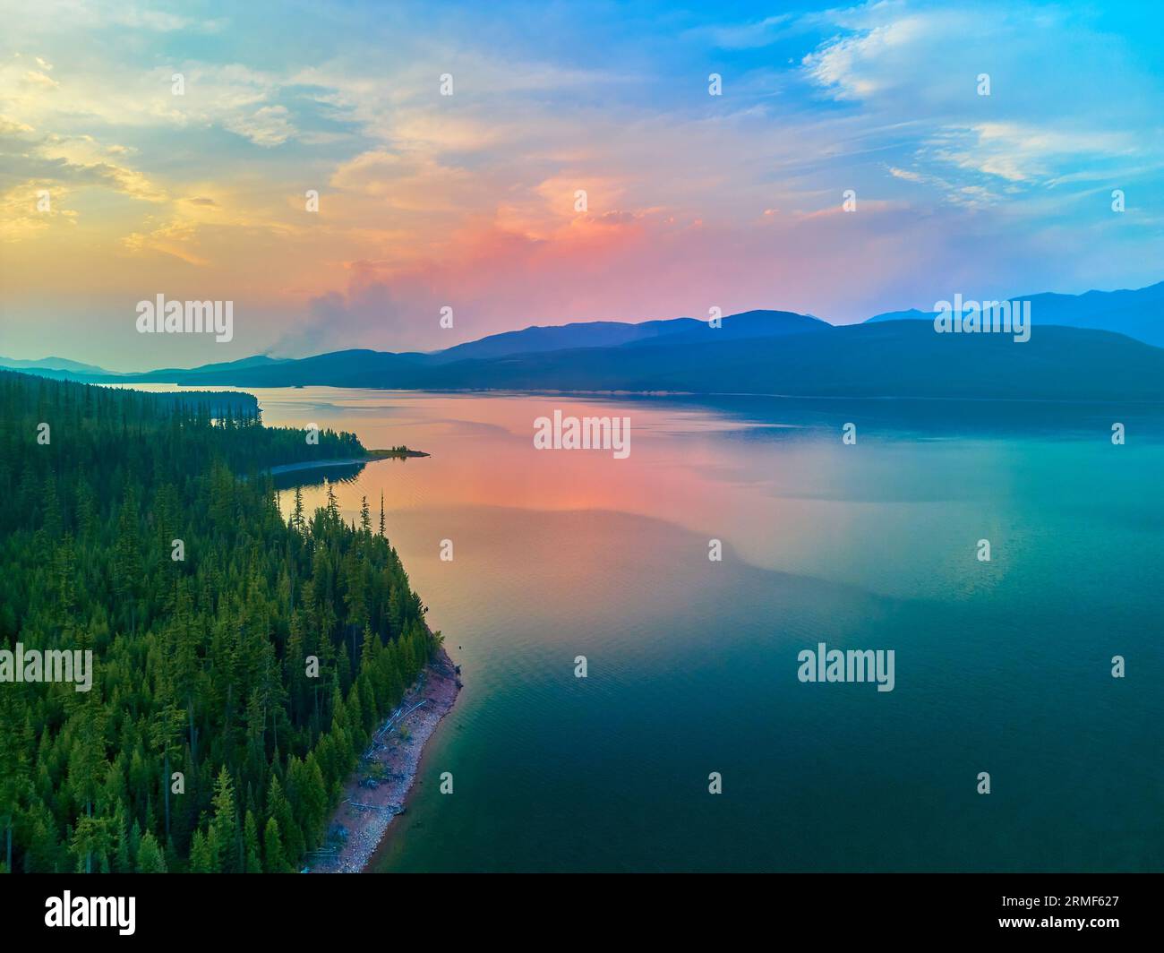 Aerial View Of Hungry Horse Reservoir With Forest Fire In The Distance