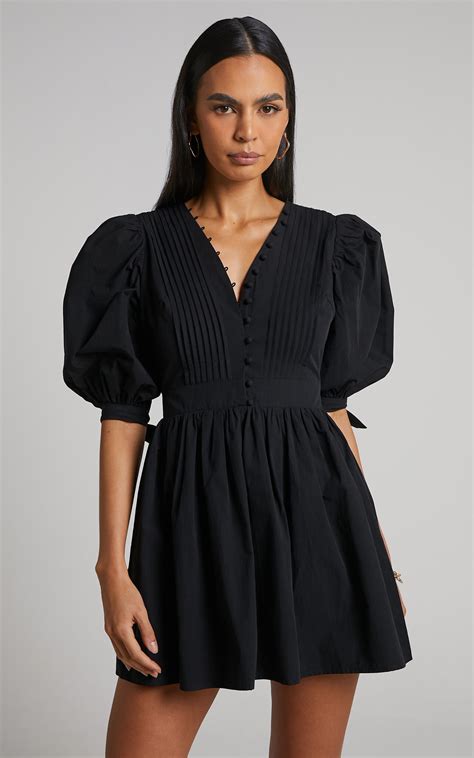 Show Up And Show Off In Our Zandra Puff Sleeve Dress This Pretty Mini